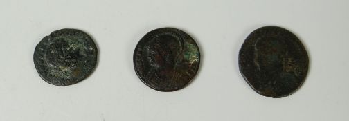 Three Roman coins including one with a head of Constantine