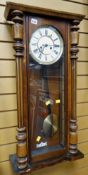 A mahogany cased Vienna wall clock