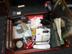Crate of miscellaneous items including a Phillips heat lamp, rechargeable torch, books etc