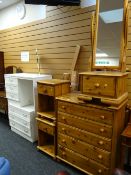 A parcel of honey pine bedroom furniture including chest of drawers, bedside cabinet, cheval