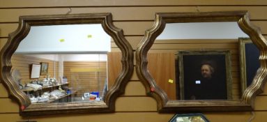 A pair of modern gilt effect wall mirrors