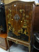 A reproduction mahogany dome top cocktail cabinet with Oriental & gilt decoration on cabriole legs