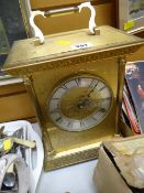 A large mantel clock together with a selection of mainly classical single records