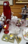 A decorated cranberry glass jug, onyx tableware etc