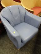 A modern pale blue leather club chair