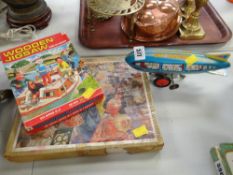 Vintage tin plate wind up airship toy & two vintage jigsaw puzzles