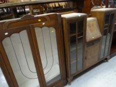 A vintage walnut drop down bureau with flanking glazed cupboards together with a vintage glazed