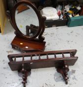 A modern mahogany toilet mirror together with a darkwood ornate wall shelf