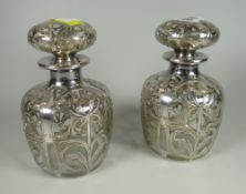 A pair of sterling silver overlaid decoration Art Nouveau-style bottles