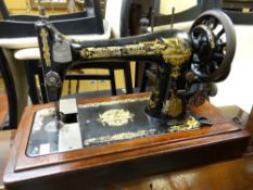 A vintage cased Singer sewing machine