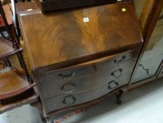 A neat vintage bow fronted drop front bureau with three drawers on cabriole legs