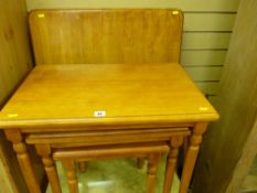 Light wood oblong breakfast table and a similar nest of three coffee tables