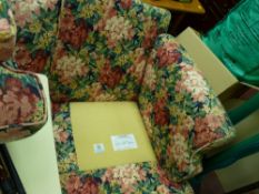 Floral upholstered couch with label 'Sinclair Nelson Ltd By Appointment to Her Majesty the Queen