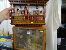 Doll's house toyshop diorama and a wooden balcony of dolls in the Mediterranean style