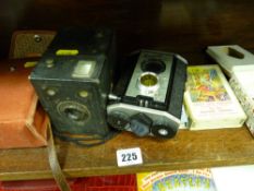 Box camera and a Brownie Reflex camera in a case and other collectables