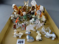 Collection of animal figurines in various materials including three Wade Disney figures