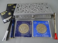 Three vintage cigarette holders including a hallmarked silver example, an aluminium pierced top