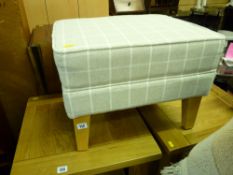 Neat modern light coloured footstool