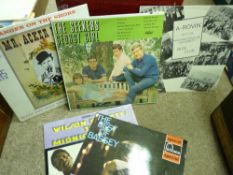 Case containing mixed genre LPs