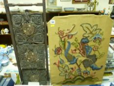 Carved and inlaid three tier folding cakestand and a woolwork embroidered firescreen