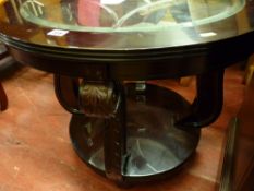 Two tier glass topped reproduction coffee table with carved supports