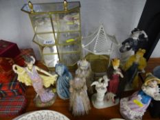 Quantity of decorative display figurines and two metalwork stands