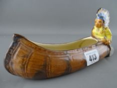 Burleigh ware posy holder in the form of an Indian in a canoe