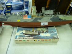 Built, possibly Airfix model of a wartime ship (incomplete) and a Froc box with model kit remnants