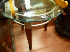 Glass topped circular coffee table