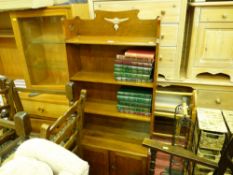Arts & Crafts style open bookshelf with base doors and a small quantity of books