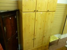 Excellent modern light wood effect three door wardrobe with base drawers and upper cupboard
