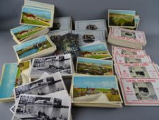Collection of vintage postcards contained in two boxes, predominantly unused local North Wales