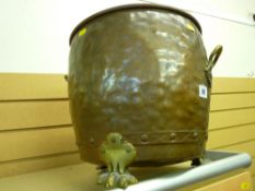 Beaten copper coal box with hairy paw feet