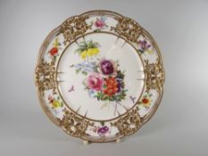 A FINE NANTGARW PORCELAIN PLATE of lobed form having a foliate, ribbon and floral moulded border