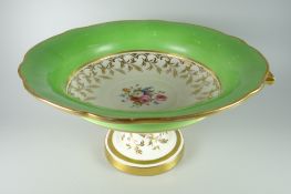 A NANTGARW PORCELAIN CENTRE DISH of lobed circular form raised over a circular base and having