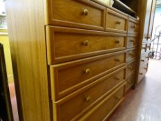 G-Plan bedroom suite comprising wardrobe with base drawers, five drawer slim chest and a two over