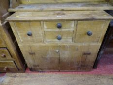 Pine sideboard having four drawers over two base cupboards