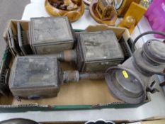 Three vintage coaching lamps and a Powell & Hanmer Ltd carbide style lamp