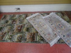 Pair of long carpet runners and a pair of small oblong Chinese washed rugs with tasselled ends