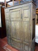 Single door wardrobe with panel and Priory style carving