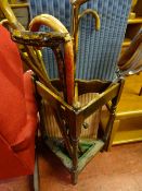 Triangular two section stick stand with drip tray and contents of shooting stick, walking sticks (