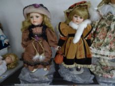 Two modern porcelain headed collector's dolls