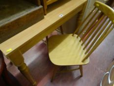 Light wood table and three light wood stick back chairs