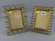 Two brass scrolled and open work photograph frames