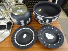 Wedgwood black Jasperware pedestal bowl, a biscuit barrel and two decorative plates