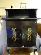 Black lacquered drinks cabinet with floral stencilling to the front