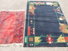 Modern geometric pattern rug and a red tasselled rug