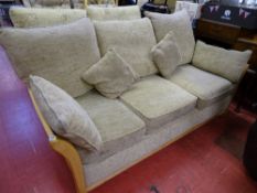 Light wood framed and upholstered three seater couch