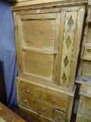 Pine press cupboard with single upper door over base drawers
