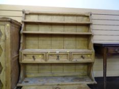 Pine wall hanging shelves having three central drawers